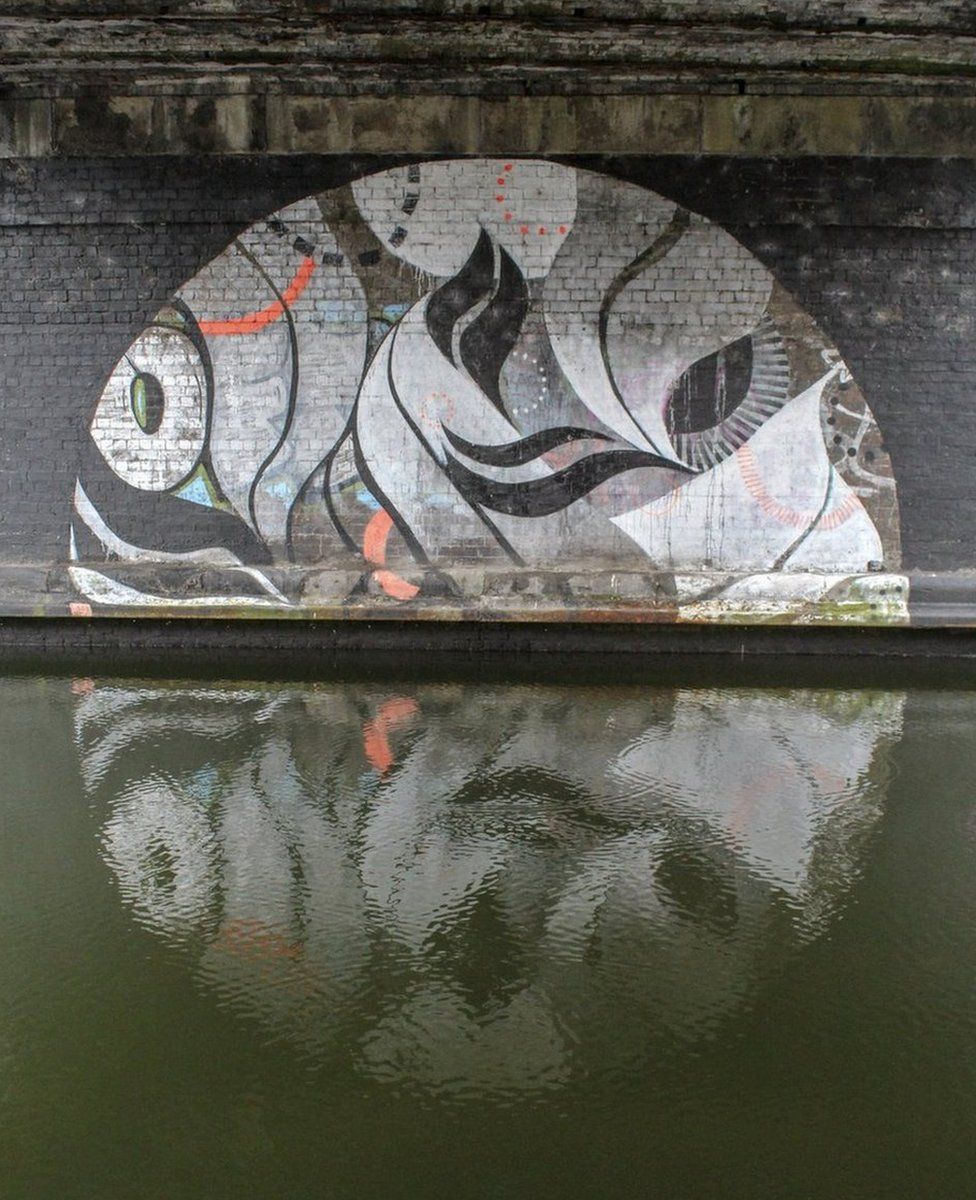 Artwork reflected in water
