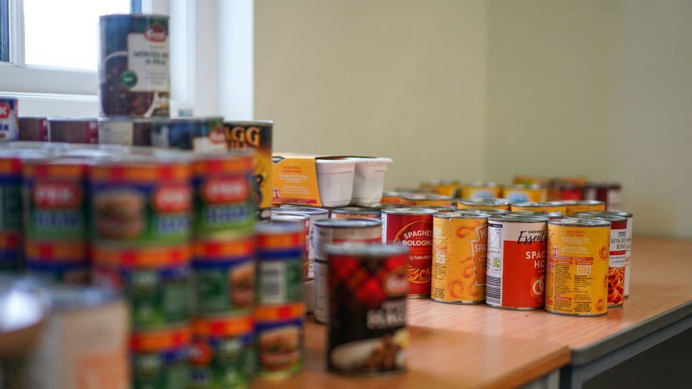 A table full of canned foods at a food bank