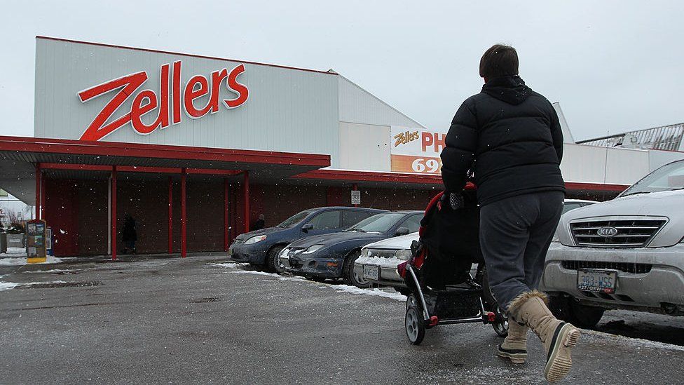 Customers come and go at the Zellers store at 3003 Danforth Ave. U.S. retailer Target Corp. is buying leasehold interests in up to 220 Zellers stores in Canada from Hudson's Bay Company for $1.83billion.
