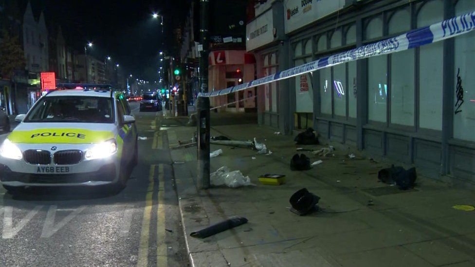 Police car remains at the scene where a car hit six pedestrians in Harringay