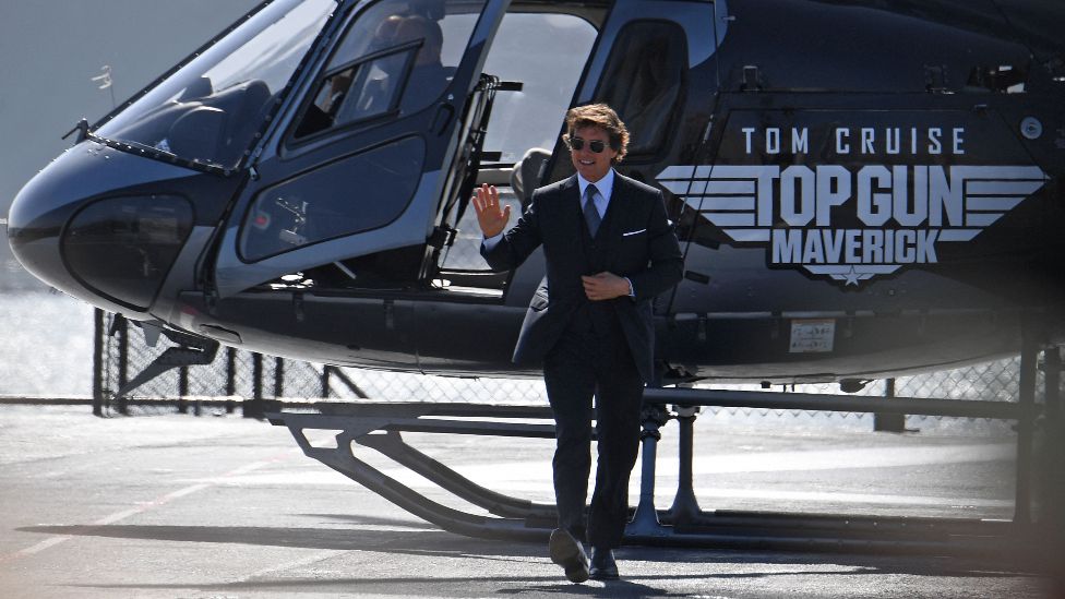 Tom Cruise landing a helicopter at the world premiere of Top Gun: Maverick