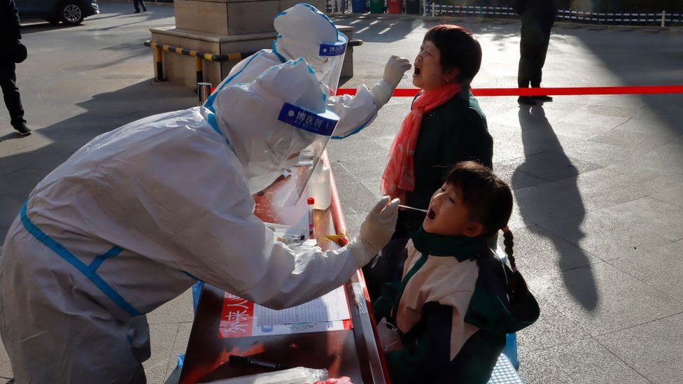 Residents undergoing nucleic acid tests for the Covid-19 coronavirus in Zhangye in China's north-western Gansu province. - China