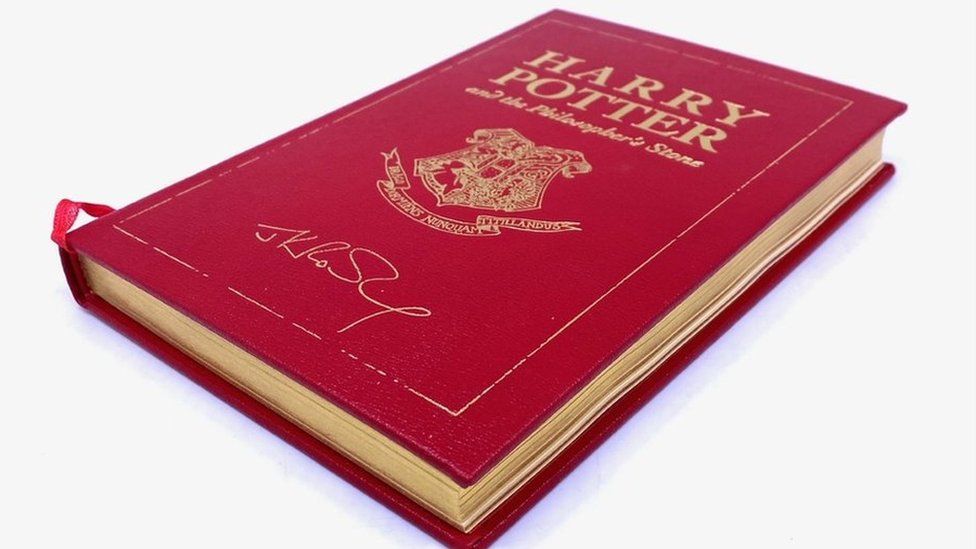 The leather-bound anniversary edition of Harry Potter and the Philosopher's Stone signed by author JK Rowling