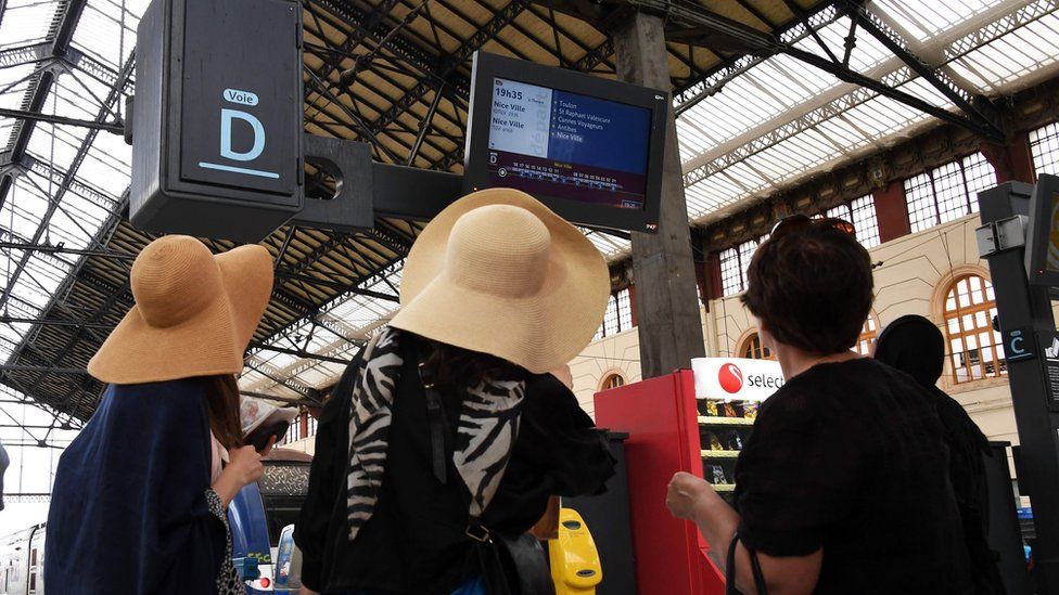 Passengers look at information screen at Saint-Charles railway station in Marseille, south-eastern France, on May 31, 2016