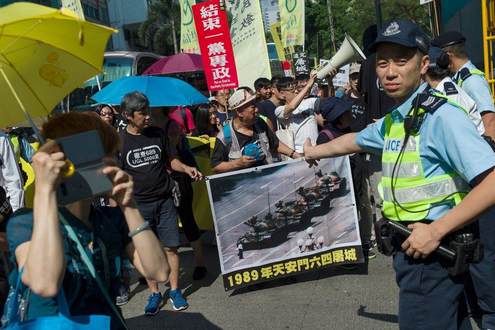 Pro-democracy activists hold banners commemorating the 4 June 1989 Beijing Tiananmen Square student massacre, during a protest march in Hong Kong, China, 28 May 2017.