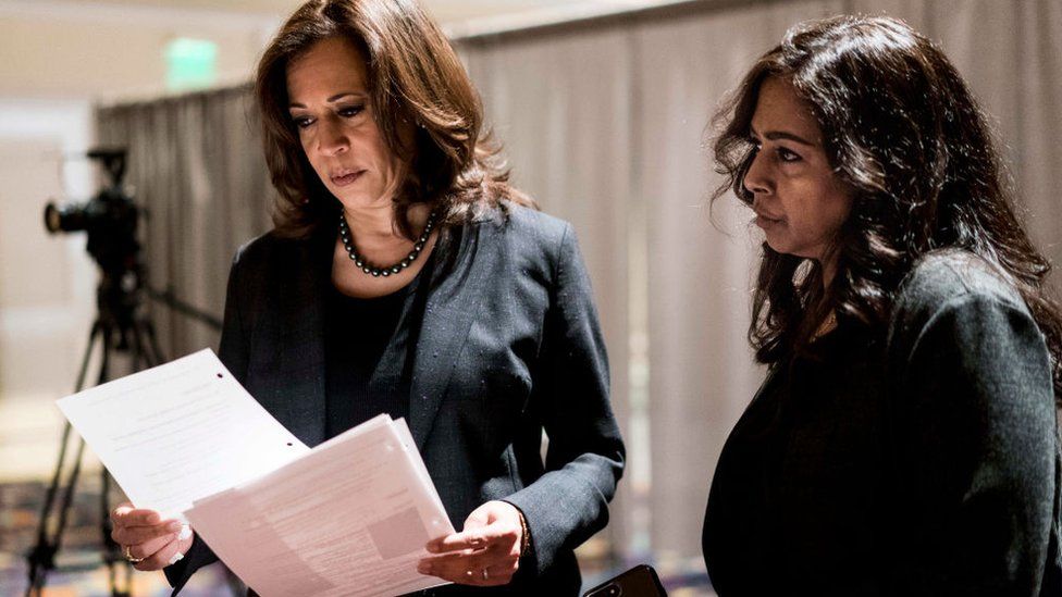 Senator Kamala Harris, with sister and advisor Maya Lakshmi Harris, prepares to speak at a 2019 event