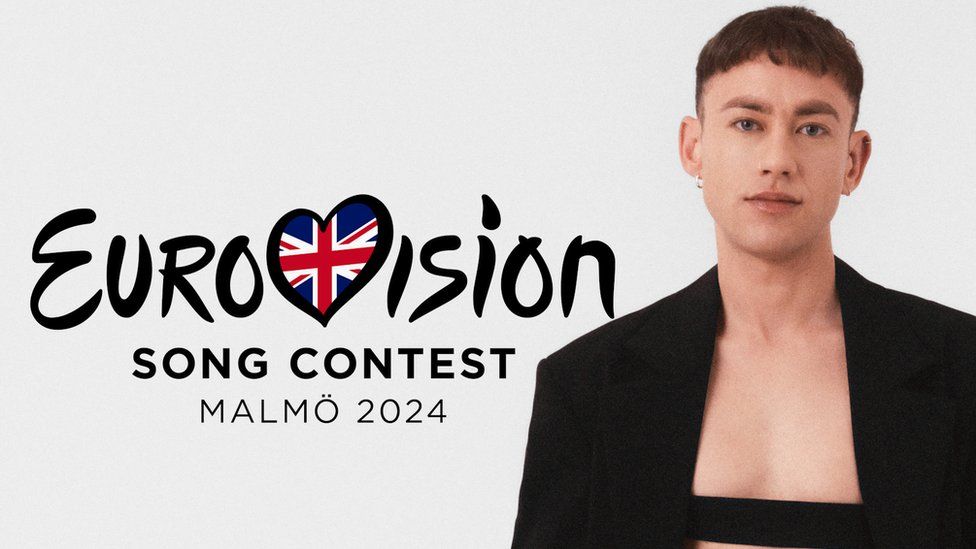 Olly Alexander next to the 2024 Eurovision logo
