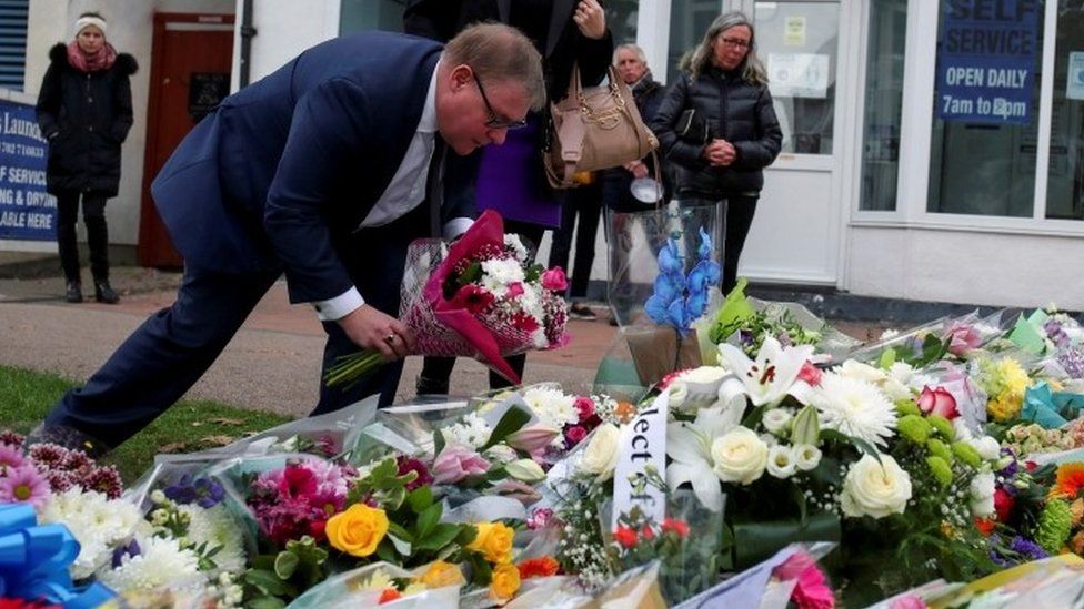 MP Mark Francois lays flowers at the scene where MP David Amess was stabbed