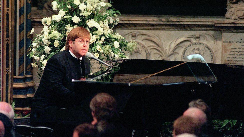 Sir Elton John playing piano and singing at the funeral of Princess Diana