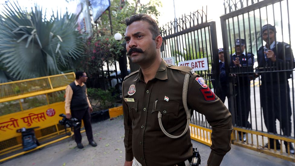 A police officer standing guard outside the BBC office in New Delhi on Wednesday