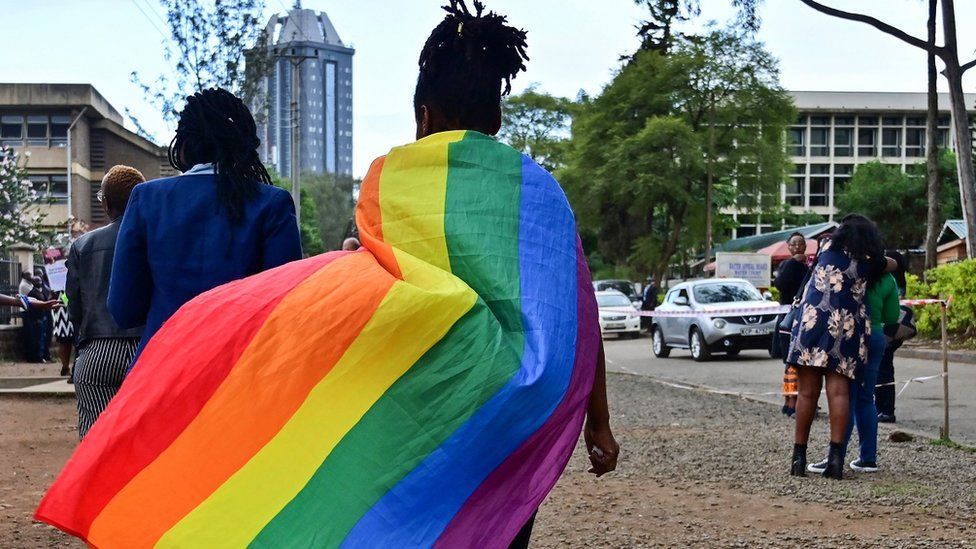 A person wears a rainbow flag in Nairobi