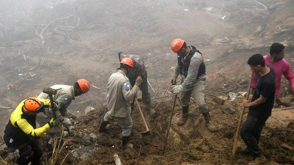 Rescue workers search for victims after a giant landslide in Petropolis on 19 February