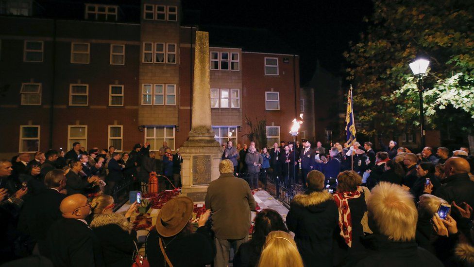 A beacon lighting ceremony takes place at the Rugeley War Memorial