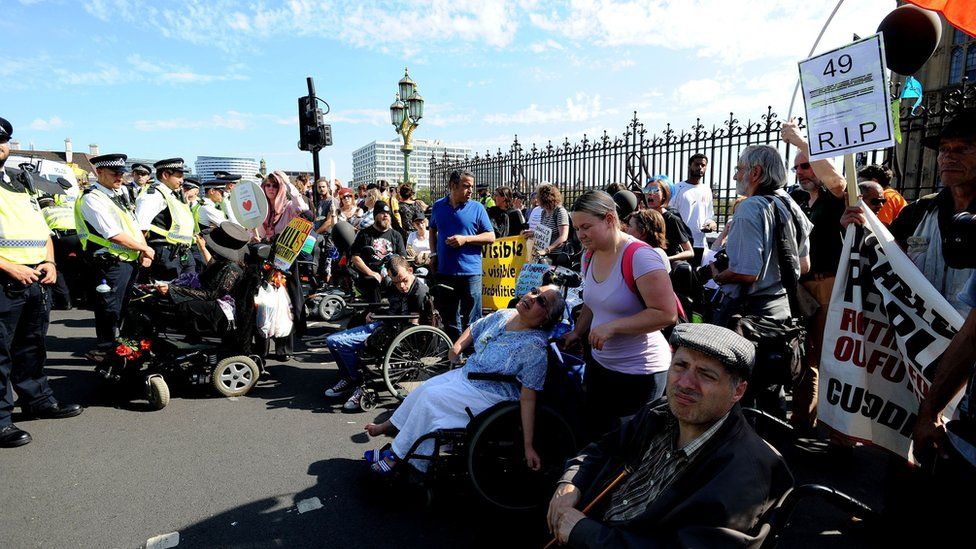 Protesters demonstrate against disability benefit cuts in Westminster