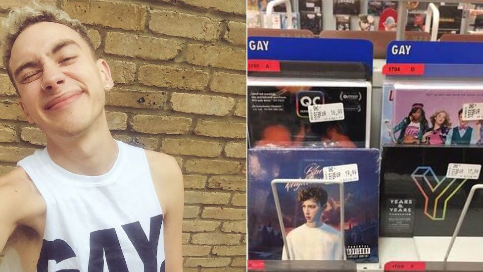 The Years and Years singer wears a t-shirt with 'gay' printed on it and shows his album in the 'gay' section at a music store