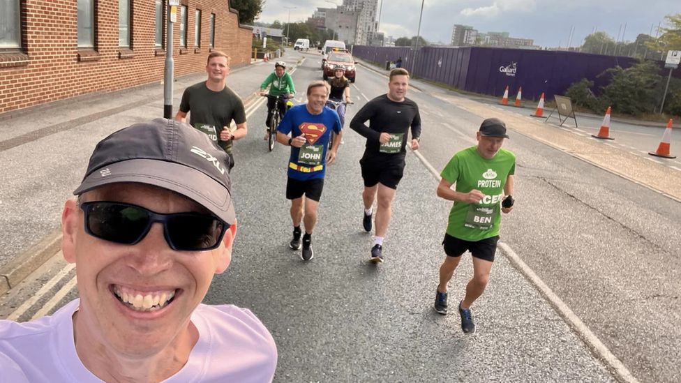 Kevin Ward (front) with David Smith, John Thurkettle, James Thurkettle and Ben Solway (with marshals Mandy Chinery and Amelia Banfield on wheels)