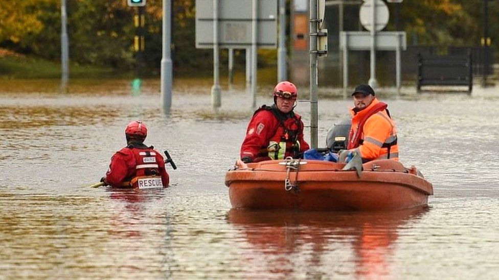 Rescuers using a boat to get around Rotherham