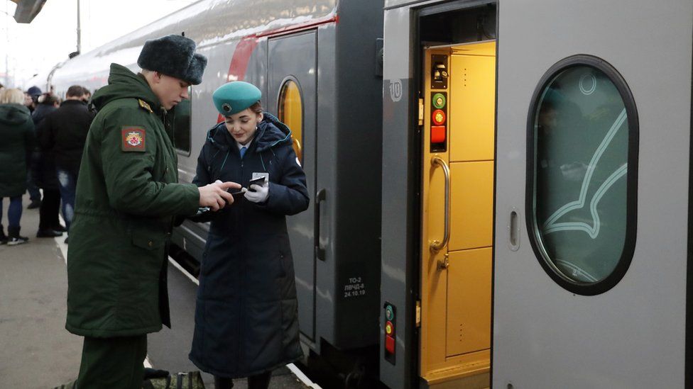 Passengers board the Tavria train to Sevastopol from the Moscow railway station in St. Petersburg, Russia, 23 December 2019
