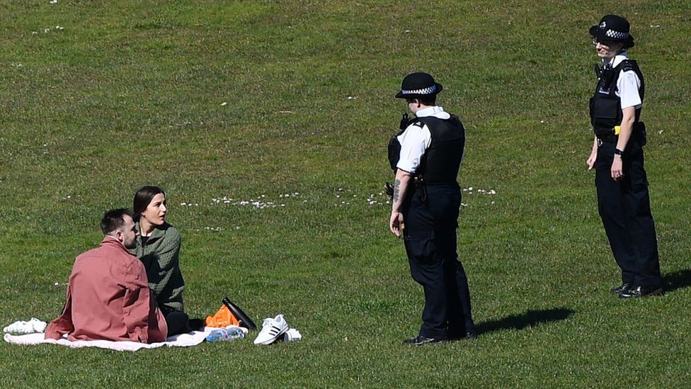 Police speak to couple in London park