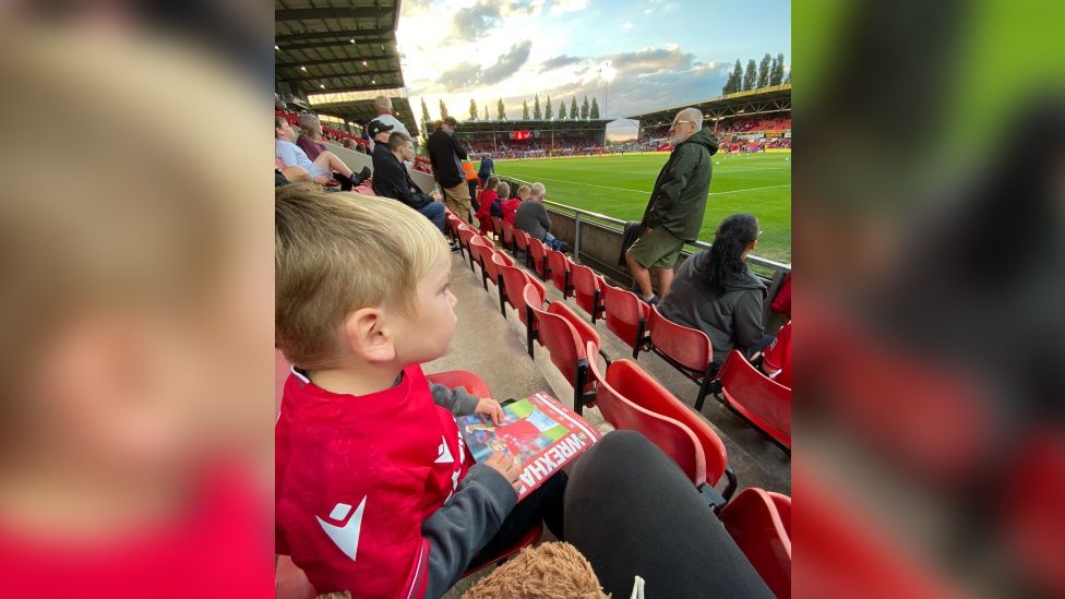 Cerebral palsy: Wrexham boy gets first football boots - BBC News