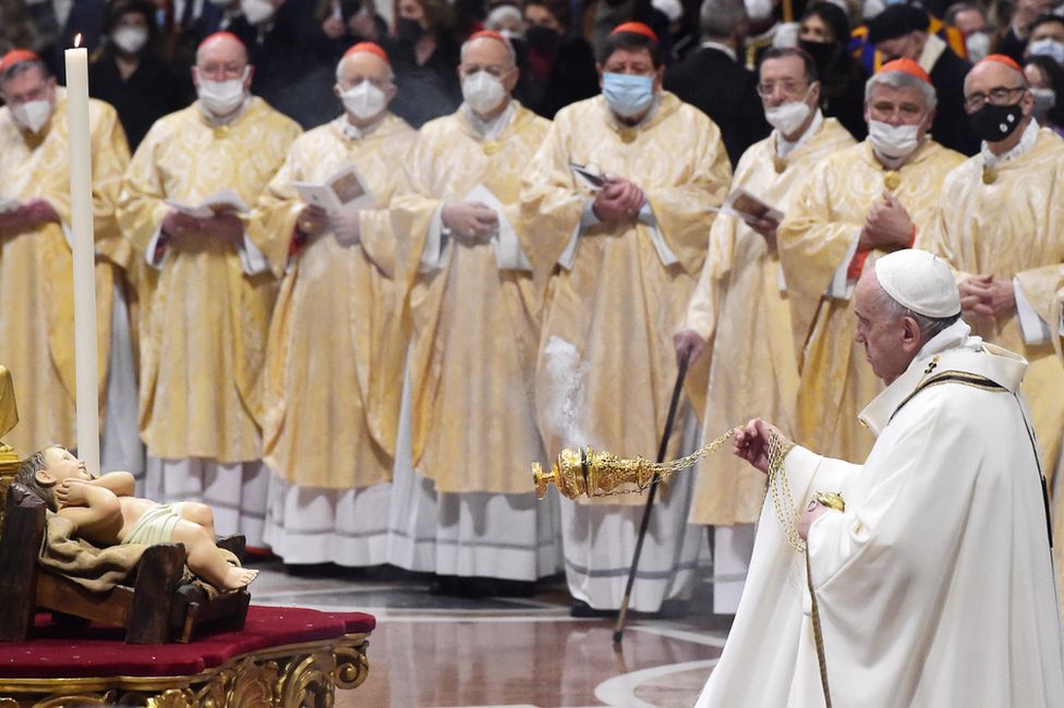 Pope Francis (right) leads a Christmas Eve Mass at St Peter's Basilica in Vatican City. Photo: 24 December 2021