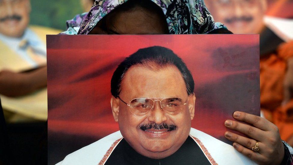 Supporters of Pakistan's Muttahida Qaumi Movement (MQM) party hold photographs of party leader Altaf Hussain as they stage a sit-in calling for his release in Karachi on June 3, 2014.