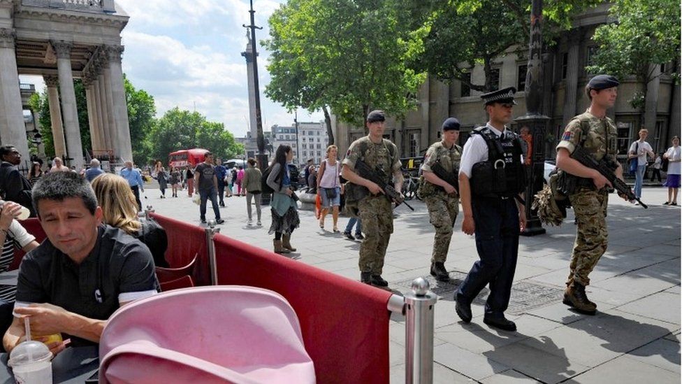 Troops join police officers on Whitehall, London