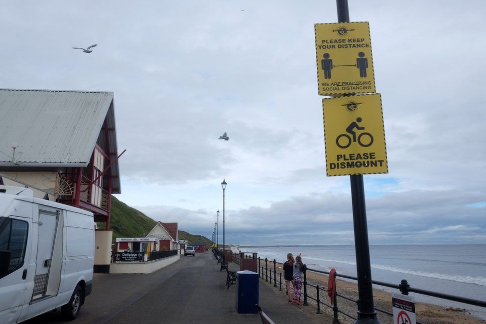 Social distancing signs on Saltburn Promenade