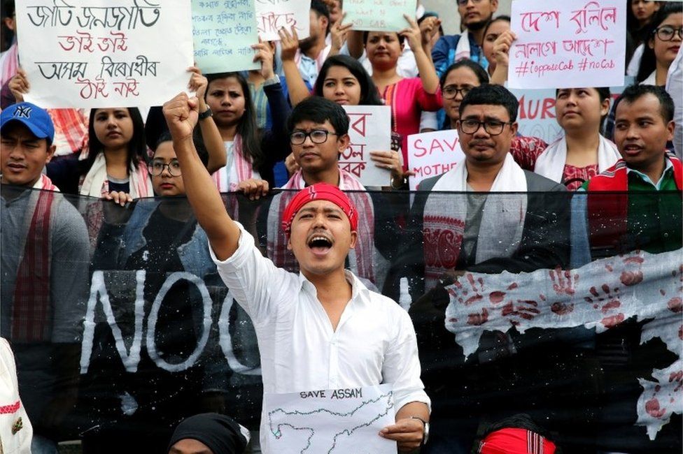 Members of the Assamese student community hold banners and shout slogans during a protest against the Citizenship (Amendment) Bill (CAB), in Bangalore, India, 14 December 2019.