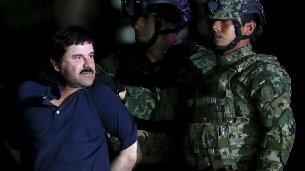 Joaquin "El Chapo" Guzman is escorted by soldiers
