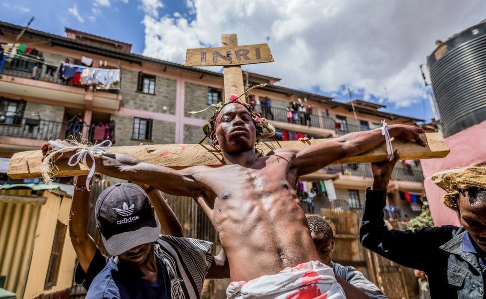 Christian devotees re-enact the Way of the Cross, or Jesus Christ's passion, during a Good Friday commemoration in the Kibera slum of Nairobi, Kenya - 19 April 2019