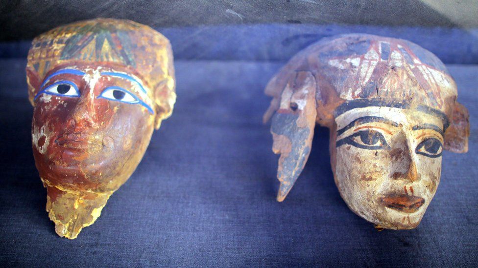 Painted wooden masks on display at a tomb at Draa Abul Naga necropolis on Luxor, Egypt, 9 December 2017