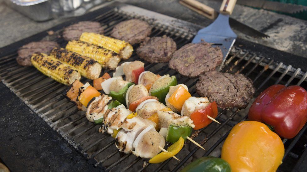 Burgers, kebabs and other foods on a barbecue