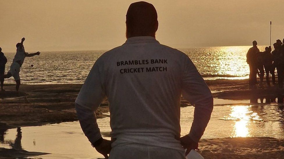 Brambles sandbar cricket match at sunrise