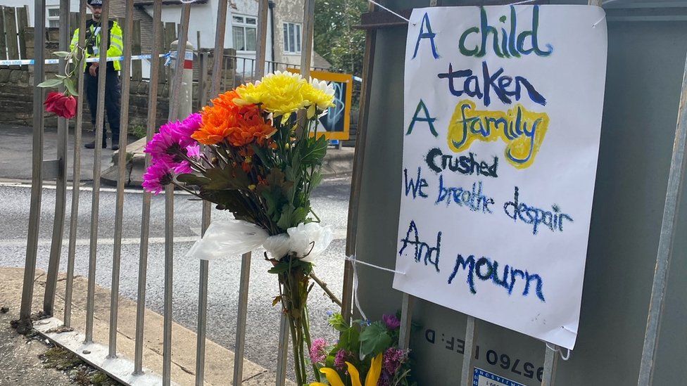 Flowers and messages have been left at the scene