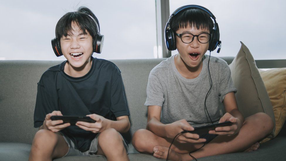 Children playing video games