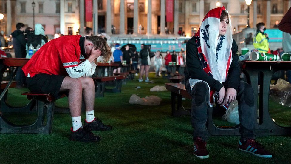 Fans after England lose the game on penalties at the Trafalgar Square Fan Zone in London