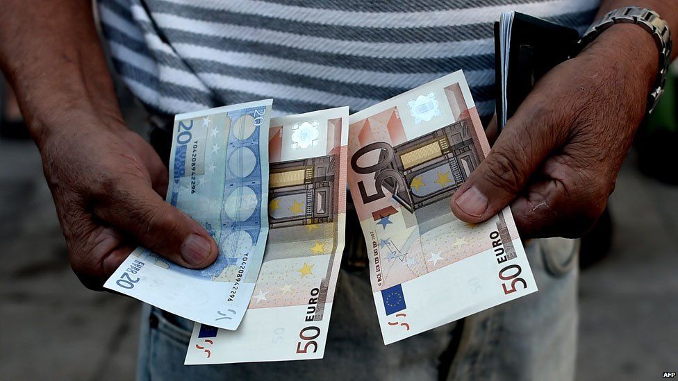 Man with euro notes