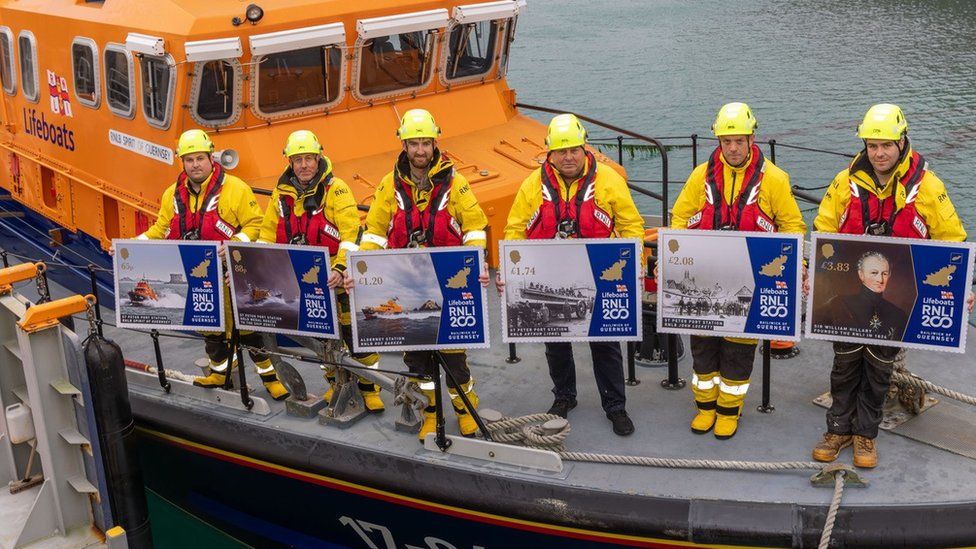 RNLI Guernsey crew with the stamps