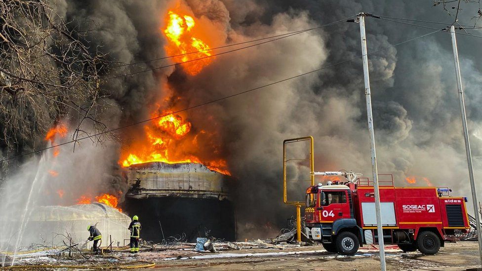 Firemen work to extinguish fire after a blast at an oil terminal in Conakry, Guinea December 18, 2023.