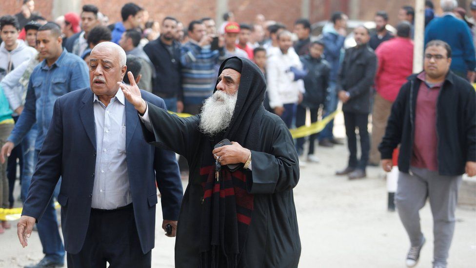 A priest gestures at the site of attack on a church in the Helwan district south of Cairo, Egypt on 29 December 2017