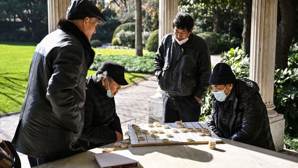 Men play Chinese chess in a park in the Jing'an district in Shanghai