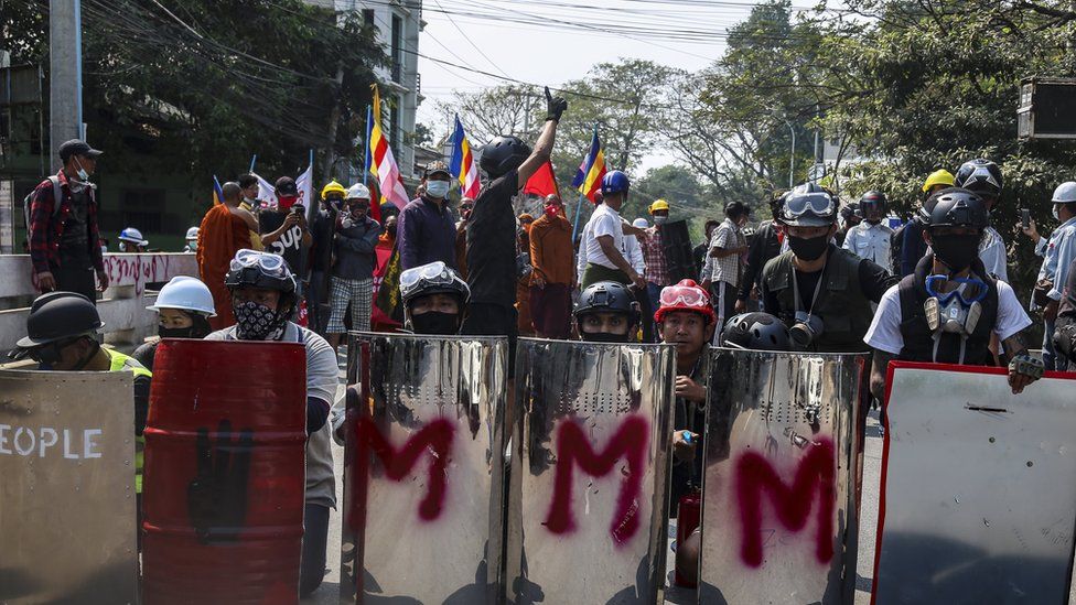 Demonstrators carried shields as they prepared for clashes with Myanmar armed forces during a protest against the military coup in Mandalay, Myanmar, 07 March 2021