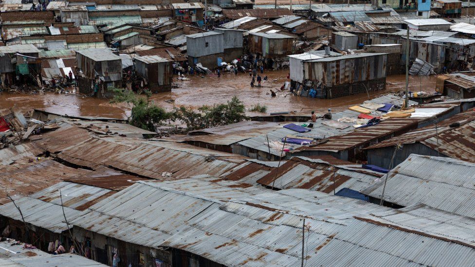 Residents of Mathare slum try to salvage goods from their destroyed houses