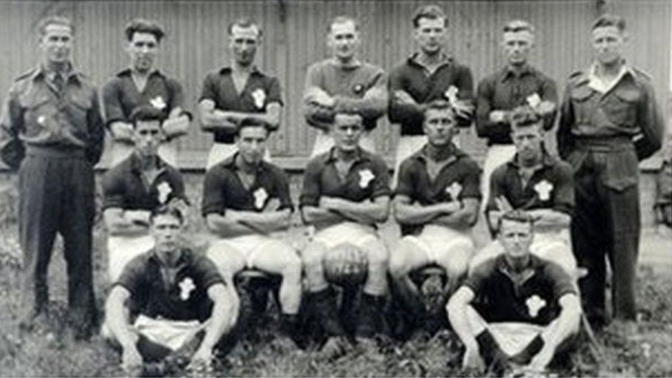 Wales football team at Auschwitz - Mr Jones is in the middle of the back row