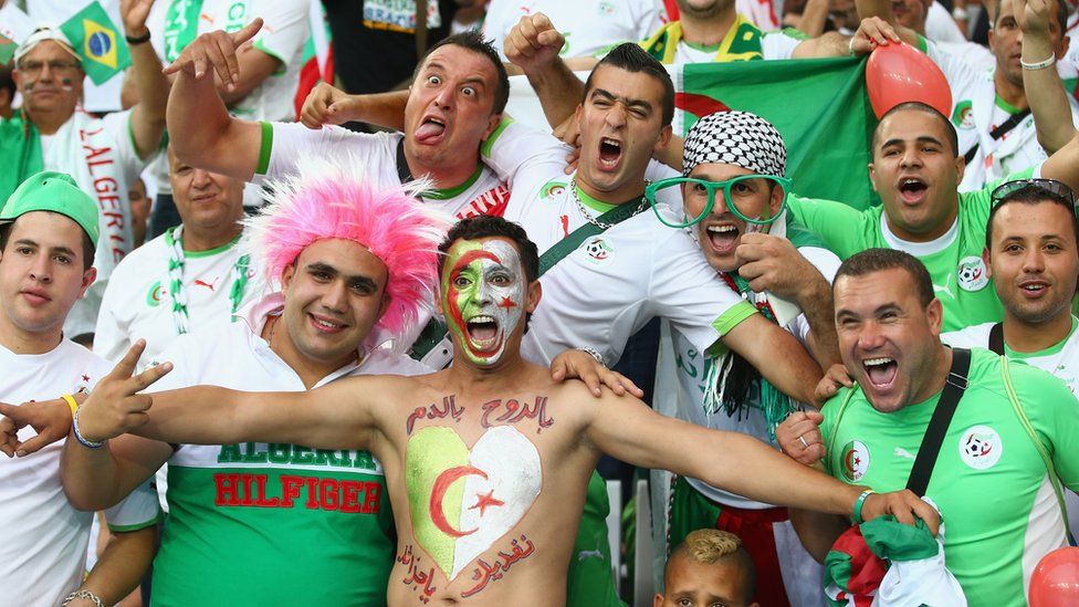 Algerian football fans watching a match