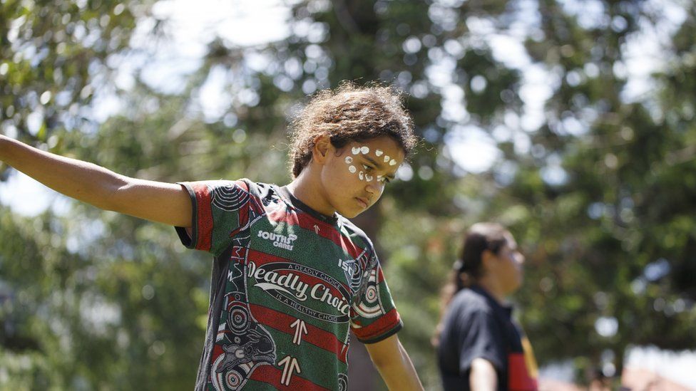 A kid performs a traditional dance at Musgrave Park during the rally. Indigenous Yuggera and Turrbal people organised a rally known as Meanjin on a date synonymous with the beginning of British colonial rule and oppression of Aboriginal people.