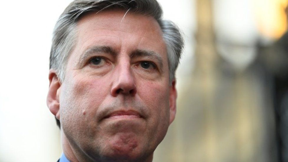 Chairman of the 1922 Committee Graham Brady looks on as he speaks to the media outside the Houses of Parliament