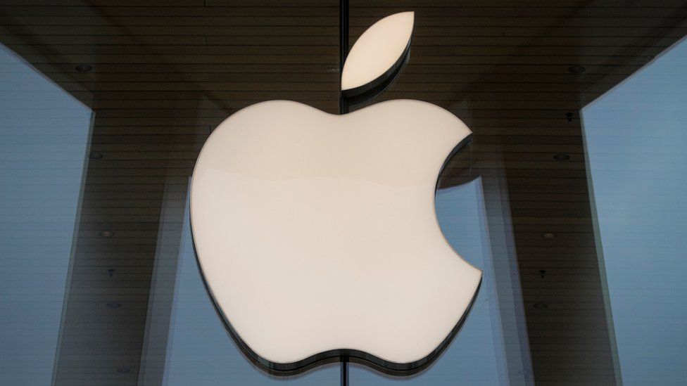 An Apple logo bolted to the glass exterior of a New York store is shown in this photo