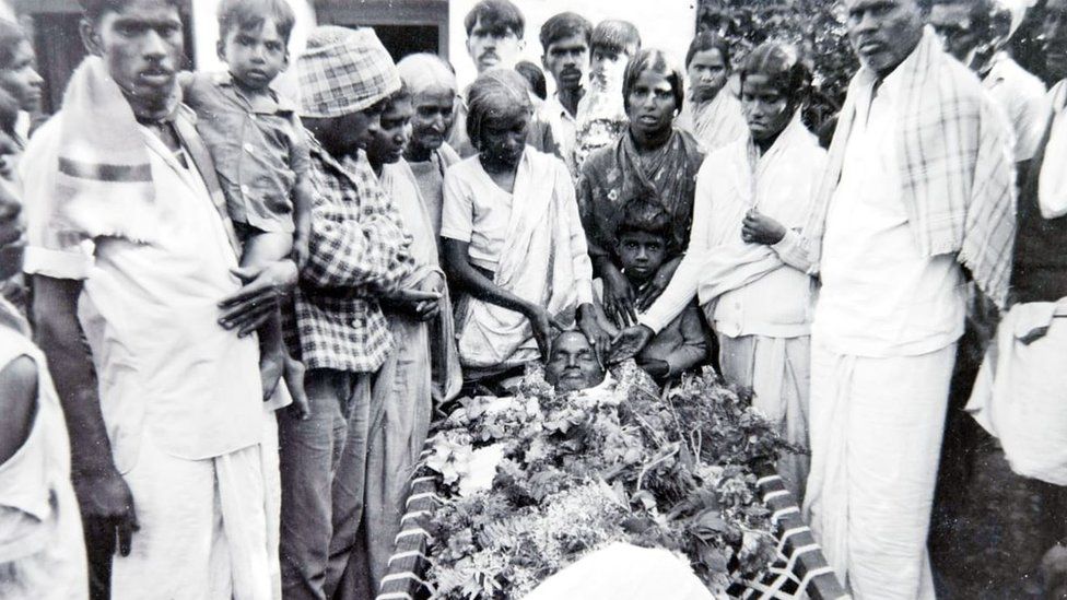 Relatives surrounding a body